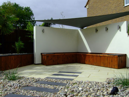 Shade sail with bench and rendered walls